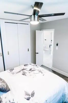 a bedroom with a bed and a ceiling fan at Welcome to 305 Rentals in Miami Gardens