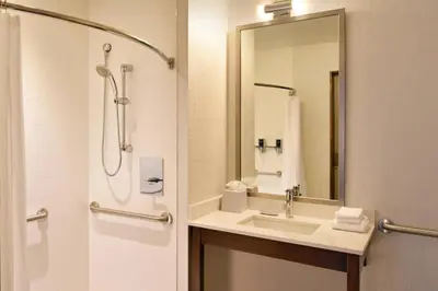 a bathroom with a sink and a shower at Four Points by Sheraton Coral Gables in Miami