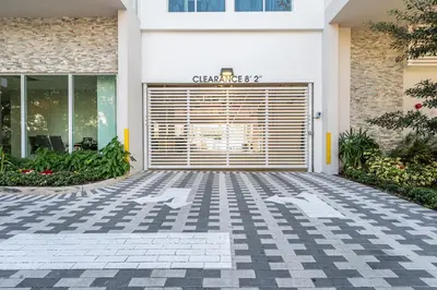 a garage door in front of a building at Resort-Style 1 Bed Condo with Pool Parking Rooftop & Gym in Hollywood