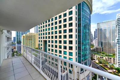 a balcony with a view of a tall building at Condo That Will Make Feel the Ocean Breeze Close in Miami