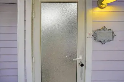 a door to a house with a sign on it at Tropical Oasis 2BR w Pool in Fort Lauderdale
