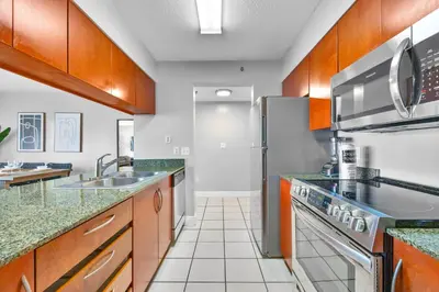 a kitchen with a sink and a refrigerator at The Best Amenities In One-Site in Miami