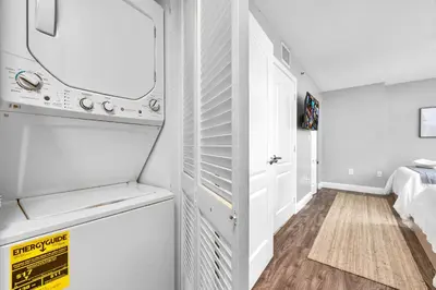 a room with white walls and a white closet at The Best Amenities In One-Site in Miami