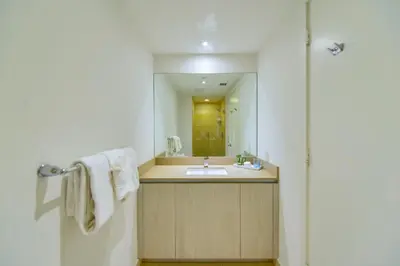 a bathroom with a sink and a mirror at Sun and Beach Closer of You! Condo All-In in Hollywood