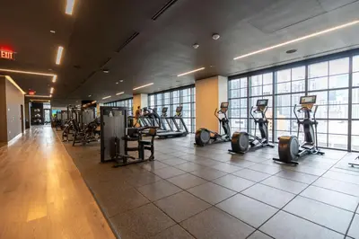 a gym with treadmills and ellipticals in a building at RumRunner - Hotel style amenities in the heart of Miami in Miami