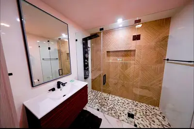 a bathroom with a sink and a shower at New! Upscale Modern waterfront apartment 3BR 3BA in Miami
