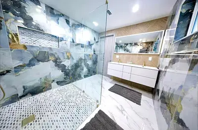 a bathroom with a glass shower and a sink at New! Upscale Modern waterfront apartment 3BR 3BA in Miami