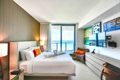 a bedroom with a bed and a large window at Level Up in This Condo w Breathtaking Views! in Hollywood