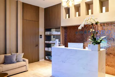 a lobby with a reception desk and a couch at Level Up in This Condo w Breathtaking Views! in Hollywood
