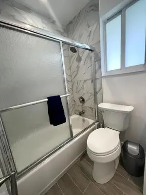 a bathroom with a toilet and a shower at Tranquil Studio W Parking 10 min to Beach FLL in Hollywood