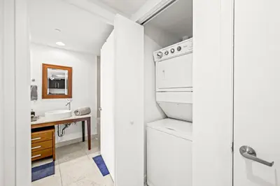 a bathroom with a white refrigerator and a sink at Magnificent Unit with Priceless Views W Icon in Miami