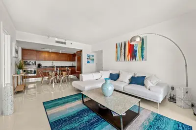 a living room with a white couch and a table at Magnificent Unit with Priceless Views W Icon in Miami