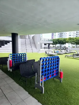 a group of blue and red ping pong balls on the grass at Miami Myami Miamí Studio Apartment with Balcony in Miami