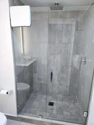 a shower with a glass door in a bathroom at Miami Myami Miamí Studio Apartment with Balcony in Miami