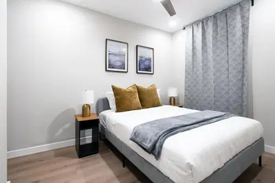 a bedroom with a large bed and a window at Prestige Brickell Miami Suite in Miami
