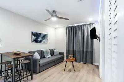 a living room with a couch and a table at Prestige Brickell Miami Suite in Miami