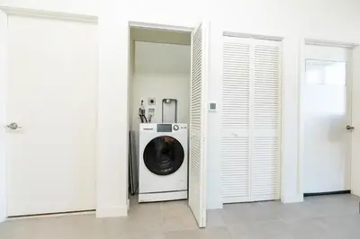 a washer and dryer in a room with white walls at The Chill Spot in Miami