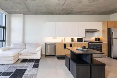 a kitchen with a couch and a table in a room at The Chill Spot in Miami