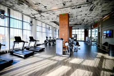 a gym with a lot of exercise equipment and windows at Corner Modern Ocean View Low Floor in Hollywood