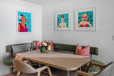 a dining room with a wooden table and chairs at 37th Floor - 1bdrm Unt amazing View at Downtown Miami in Miami
