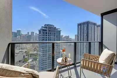 an apartment balcony with a view of the city at Oasis Studio with Gym & Pool in Miami