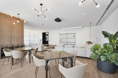 a living room with tables and chairs and a couch at Stylish Studio -Amenities & Pool in Miami
