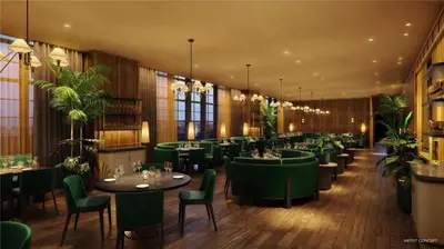 a restaurant with green tables and chairs and plants at Stylish Studio -Amenities & Pool in Miami