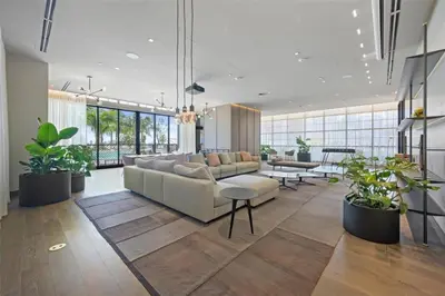 a living room with a couch and some plants at Great Studio Pool Gym & Views in Miami