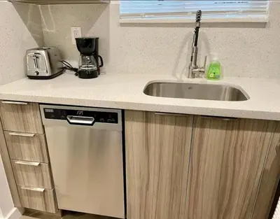 a kitchen with a sink and a dishwasher at Modern in heart of Hollywood in Hollywood