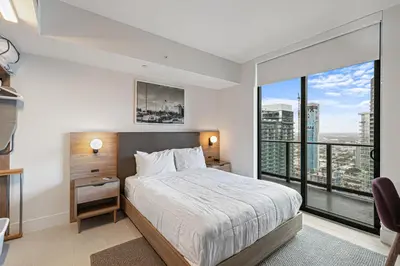 a bedroom with a bed and a large window at Grand Vista 4501 in Miami