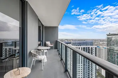 a balcony with tables and chairs on a building at Grand Vista 4501 in Miami