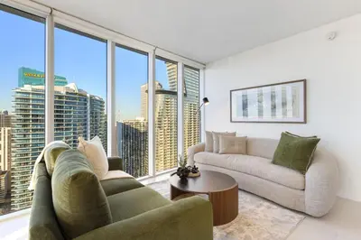 a living room with a couch and a table at Sky High Penthouse Corner 2BR 2BA Icon Brickell in Miami