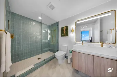 a bathroom with a tub and a toilet and a sink at Contemporary 2-BD Condo in Downtown Miami - Skyline & Ocean Views in Miami
