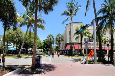 a street with palm trees in a city at Beachside Bliss Estate 4801 in Miami