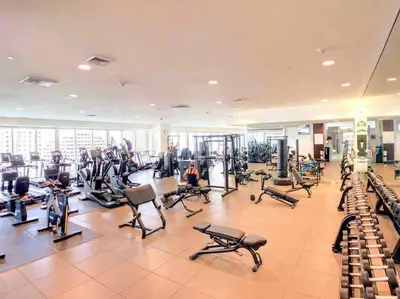 a gym with a lot of treadms and pilates equipment at Charming Ocean View 2BR 1BA ICON Brickell in Miami