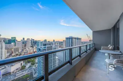 a balcony with a view of a city at Downtown 1-BD Condo with City Views in Miami