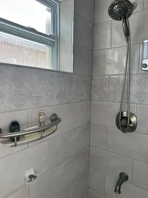 a bathroom with a shower with a window at Bed in 6-Bed Dormitory Room in Miami