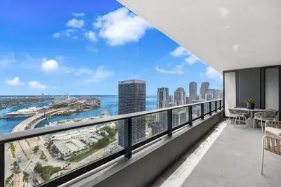 an apartment balcony with a view of the city at On 44th Floor! Condo w The Best Views & Free Parking in Miami