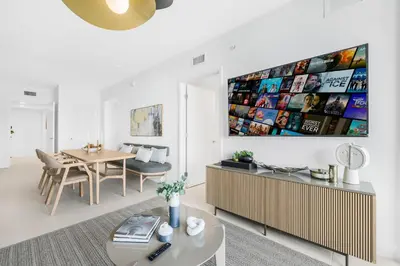 a living room with a table and a dining room at On 44th Floor! Condo w The Best Views & Free Parking in Miami