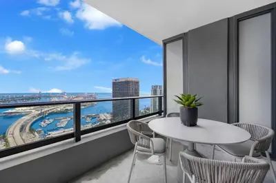 a room with a table and chairs and a large window at On 44th Floor! Condo w The Best Views & Free Parking in Miami