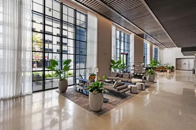 a lobby with couches and plants in a building at On 44th Floor! Condo w The Best Views & Free Parking in Miami
