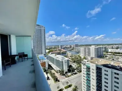 a balcony with a view of the city at Beautiful Hyde Resort Luxe 2BR Private Beachfront in Hollywood