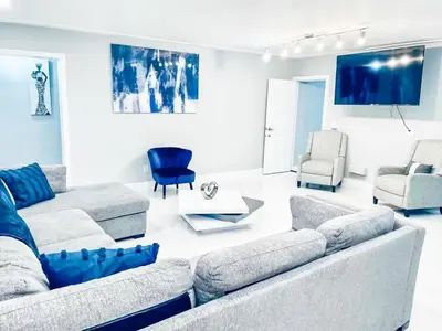 a living room with a couch and chairs at Best Location!! in Miami