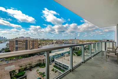 a view of a city from a balcony at 1 Bedroom & Kitchen at Beachwalk Luxe Pool - Gym in Hallandale Beach