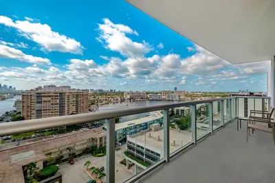 a balcony with a view of a city at 2 Bed 2 Bath at Beachwalk With Pool Gym Beach in Hallandale Beach
