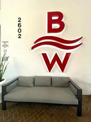 a couch in front of a wall with a wii sign at Beachwalk 2 Bedrooms & Kitchen in Hallandale Beach