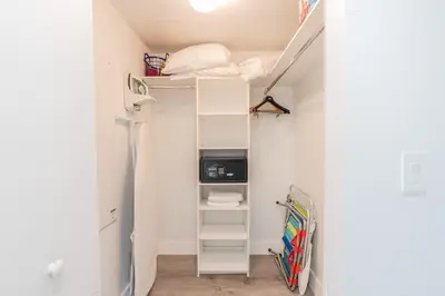 a small room with a ladder and a closet at Amazing Studio at Beachwalk with Pool & Gym in Hallandale Beach