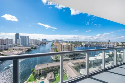 a view of a river from a balcony at 1 Bed & Kitchen at Beachwalk Luxe Pool Gym Beach in Hallandale Beach