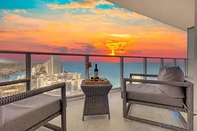 a bedroom with a view of the city skyline at Cozy Apartment with Balcony in Hollywood