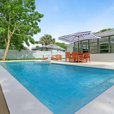 Charming 4BR Oasis with Saltwater Pool and Parking